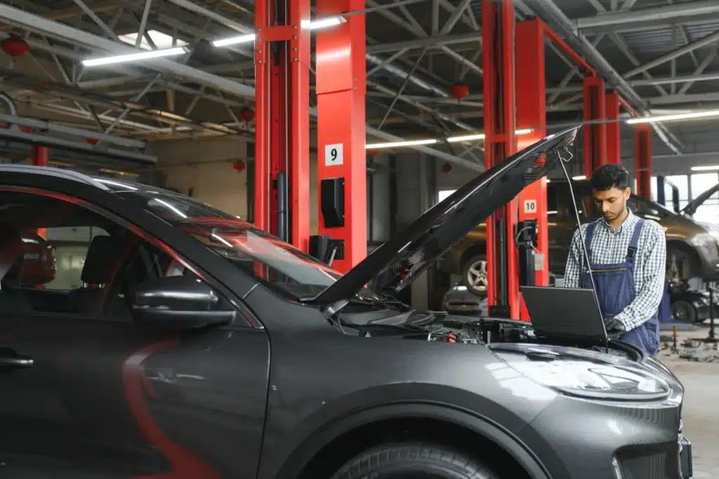 mechanic diagnosing car